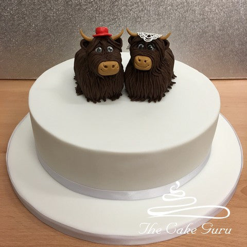 Highland Cow Bride and Groom Wedding Cake