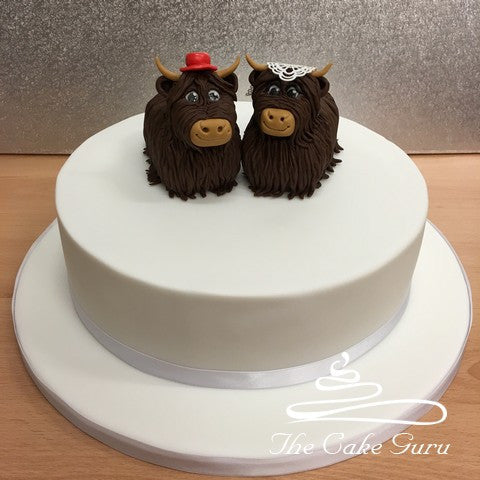Highland Cow Bride and Groom Wedding Cake